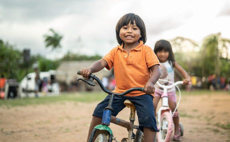 boy and girl playing with bikes