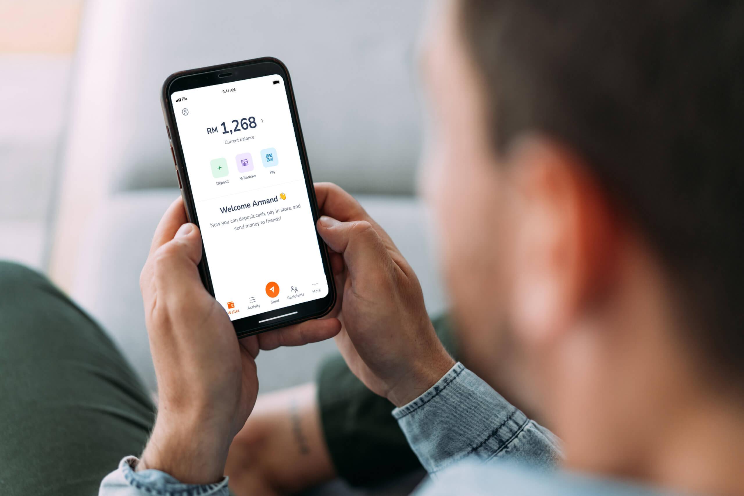 Man looking at his balance in his digital wallet.